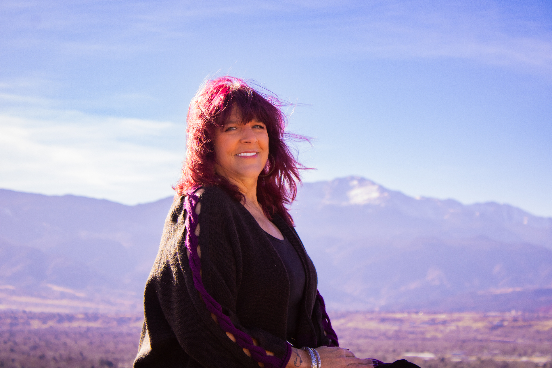 Kara St.Cyr smiling with mountains in the background